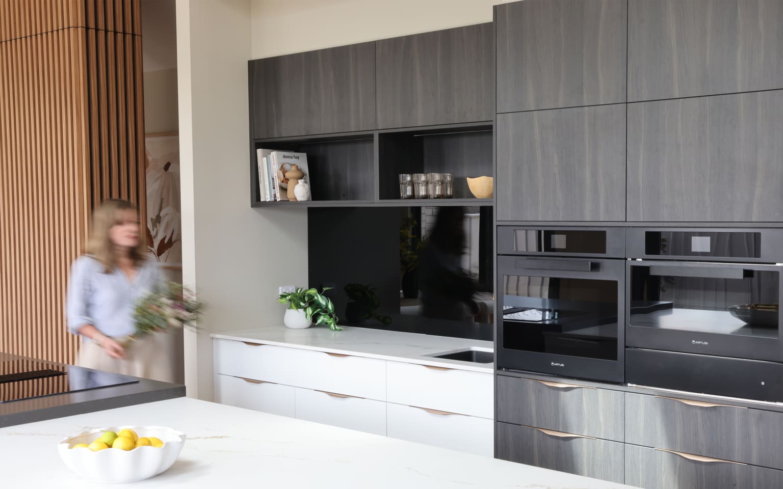 Davis Sanders kitchen with timber battens and stone benchtops